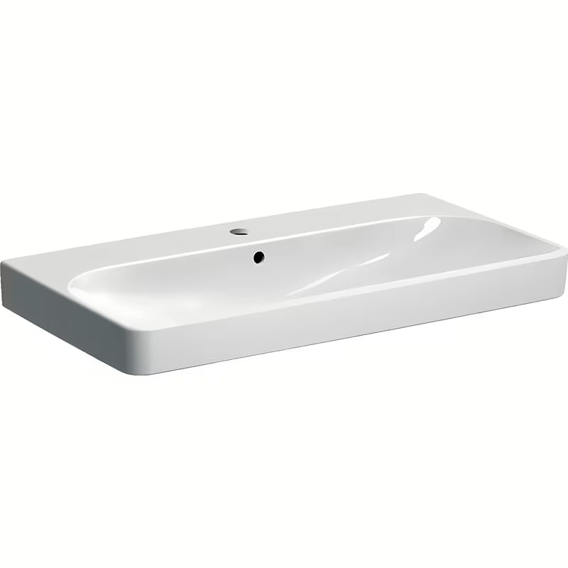 Bijeli viseći umivaonik Geberit Smyle Square 90x48 cm od sanitarne keramike s preljevom i otvorom pro za slavinu.