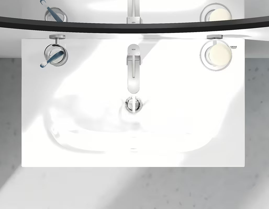 Umivaonička jednoručna baterija slavina Grohe Plus u izvedbi supersteel sa zakretnim izljevom i odvodnom garniturom.