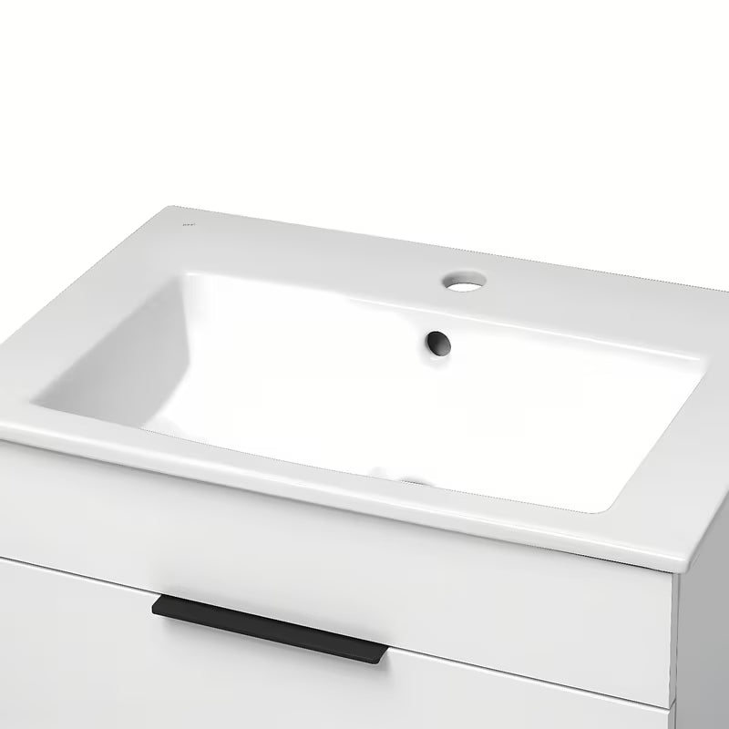 Bijeli viseća ormarić Jika Plan s keramičkim umivaonikom i ladicama s potpunim izvlačenjem.