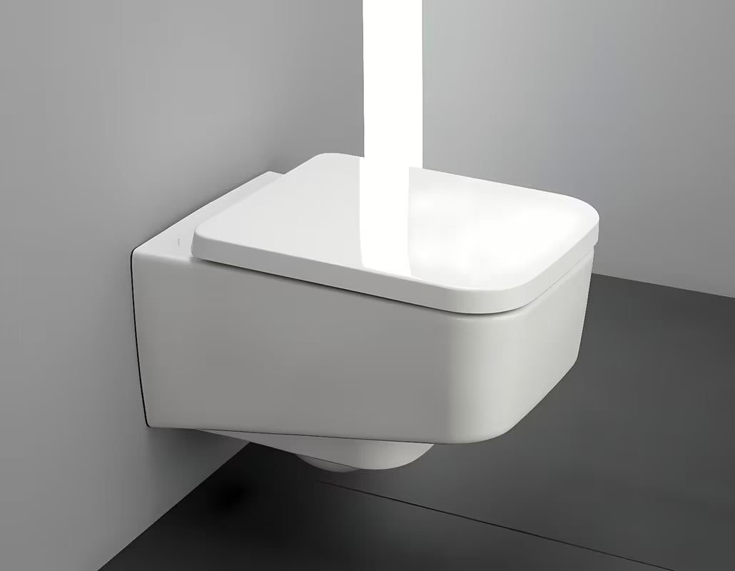 Bijeli viseća WC školjka Laufen Pro S bezrubnom izvedbom bez sustava za ispiranje i četvrtastim dizajnom.