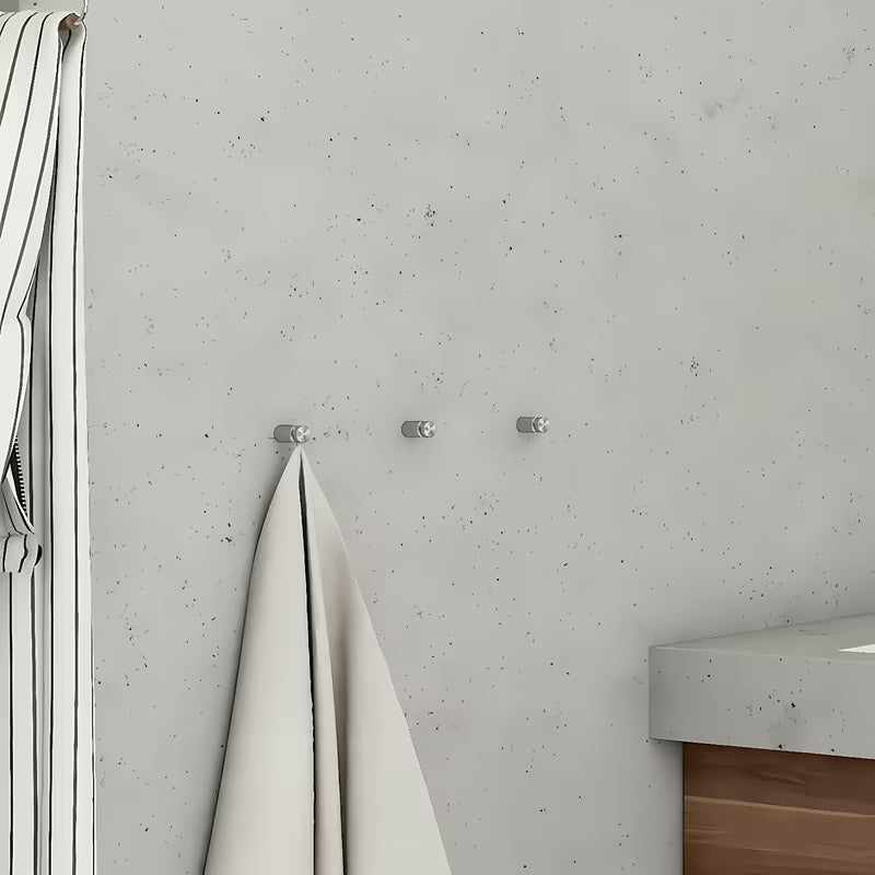 Produženi kromirani kukica Nimco Unix čistog modernog dizajna za kupaonicu.