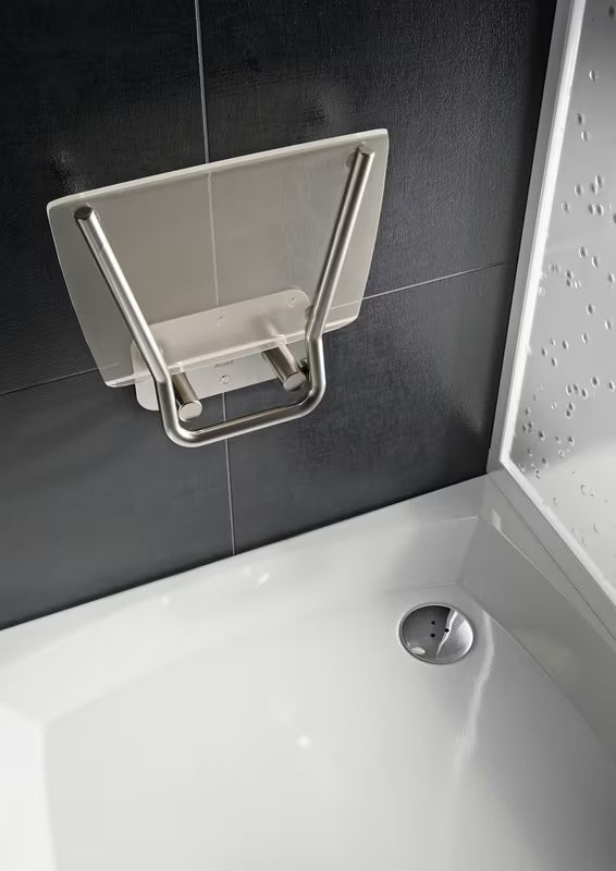 Sklopive sjedalo za tuš Ravak Ovo B II s konstrukcijom od nehrđajućeg čelika i prozirnim sjedalom Clear.