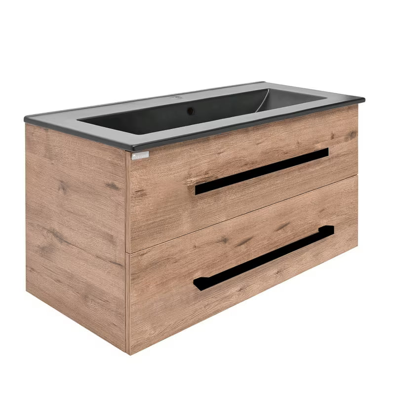 Viseća kupaonski ormarić SAT Cube Way s keramičkim umivaonikom u dekoru hrasta Wellington i crnim ručkicama.