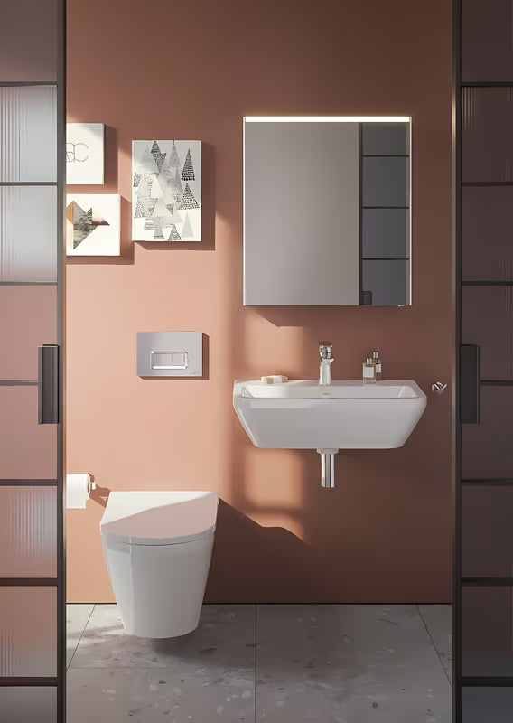 Bijeli viseći umivaonik Vitra Integra 60x36 cm od keramike s otvorom pro za slavinu u sredini i preljevom.