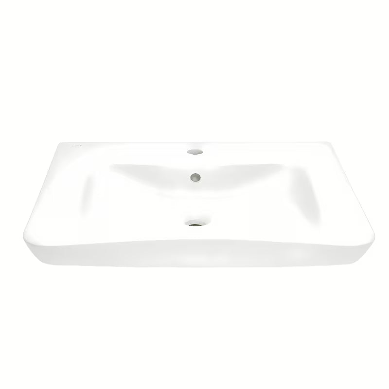 Bijeli viseće bez barijera umivaonik Vitra 65x56 cm od keramike s preljevom i otvorom pro slavinu u sredini.