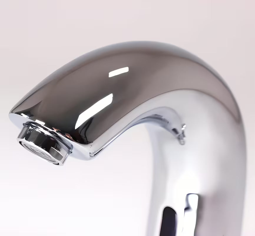 Kromirana senzorska miješalica za umivaonik Weltservis Donner s infracrvenim aktiviranjem i ručnim upravljanjem temperaturom.