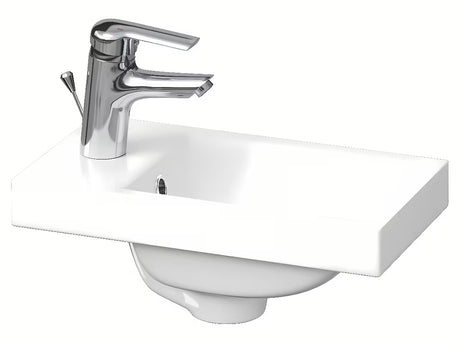 Bijeli umivaonik za kupaonski ormarić Cersanit Como 40x22 cm od keramike s otvorom za pro slavinu u sredini.