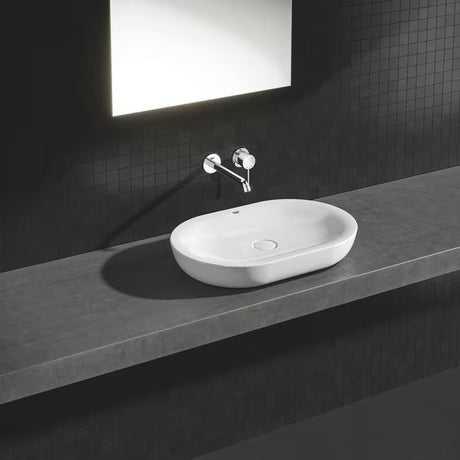 Kromirana podžbukna miješalica za umivaonik Grohe Essence New pro za zidnu montažu s ručicom i rozetom.