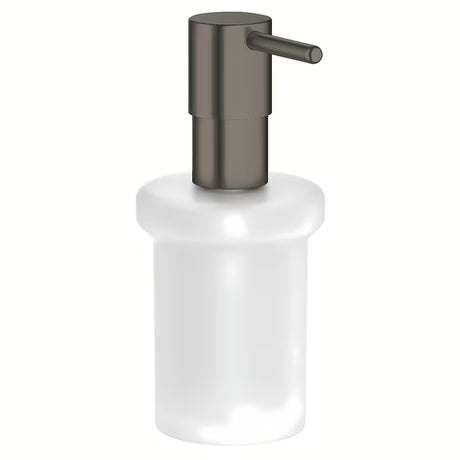 Dozator sapuna Grohe Essentials bez držača sa staklenom posudom i površinom Grohe StarLight u izvedbi hard graphite.