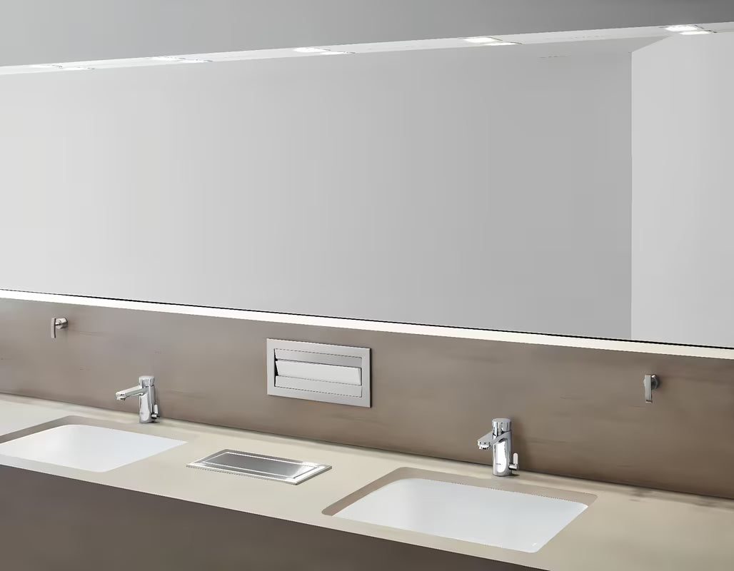 Kromirana samozatvarajuća miješalica za umivaonik Grohe Eurosmart Cosmopolitan T s tehnologijom Grohe EcoJoy.