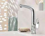 Visoka jednoručna baterija miješalica za umivaonik Grohe Eurostyle New u krom izvedbi sa zakretnim izljevom i odvodnim setom.