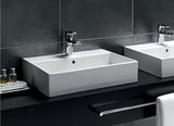 Bijeli keramički viseći umivaonik Ideal Standard Strada 71x42 cm s otvorom za pro slavinu u sredini.