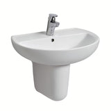 Ovalni viseće bijeli keramički umivaonik Kolo Rekord s otvorom za pro slavinu u sredini.