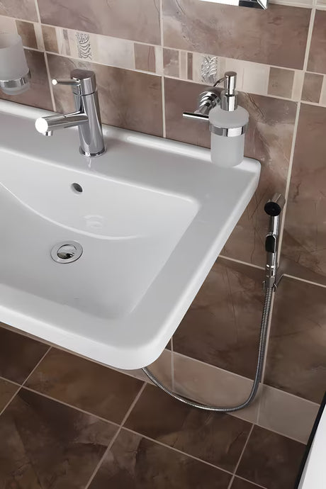 Kromirana miješalica za umivaonik Paffoni Birillo s bide tušem i preklopnikom mlaza vode.