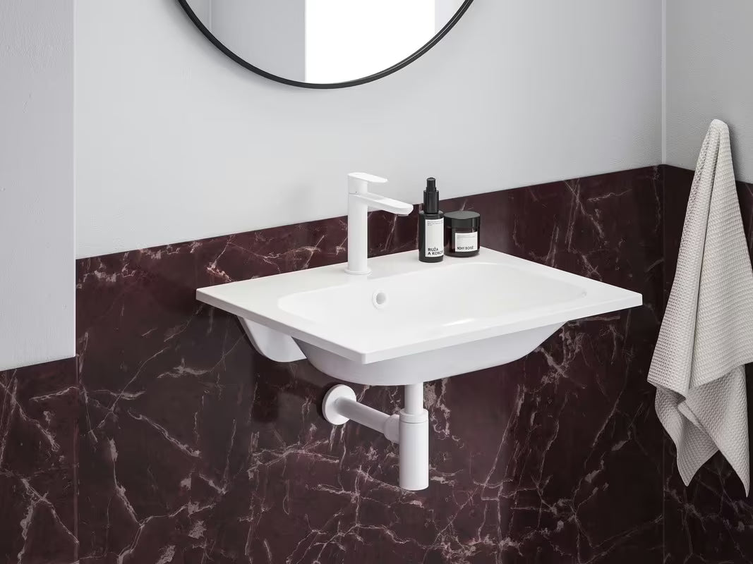 Bijeli umivaonik za kupaonski ormarić Ravak Chrome Slim 60 x 49 cm od lijevanog mramora s preljevom