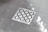 Podni sifon/slivnik Ravak SN501 s plastičnim tijelom i rešetkom od nehrđajućeg čelika, promjer 10,5 cm.