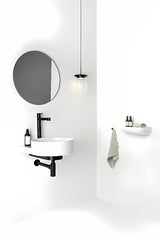 Bijeli keramički ugradbeni umivaonik Ravak Yard sa sniženom odlagališnom površinom na stražnjem dijelu