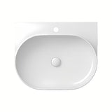 Ugradbeni keramički umivaonik Ravak Yard bijeli, ovalnog oblika i s uvučenom odlagališnom plohom.