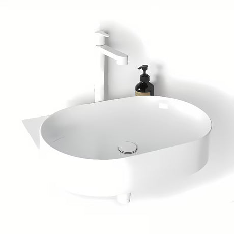 Ugradbeni keramički umivaonik Ravak Yard bijeli, ovalnog oblika i s uvučenom odlagališnom plohom.