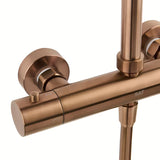 Tuš sustav SAT Aurum s termostatskom miješalicom u izvedbi rose gold brushed s nadglavnim i ručnim tušem.