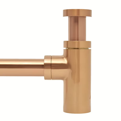 Mjedeni sifon za umivaonik SAT Aurum u boji rose gold, okruglog dizajna i promjera 32 mm.
