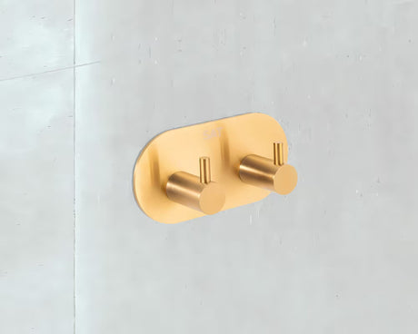 Kupaonski kukica SAT pro u izvedbi brušeno zlato pro montaža lijepljenjem bez bušenja.