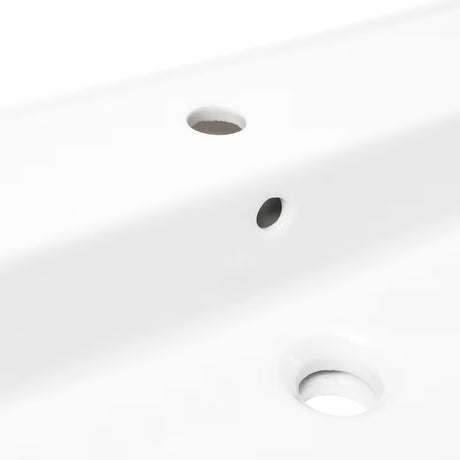 Bijeli keramički viseći umivaonik SAT Infinitio 60,5x46,5 cm s preljevom i otvorom pro slavinu u sredini.