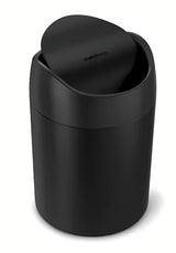 Crni stolni kanta za otpad Simplehuman Mini s preklopnim poklopcem i zapreminom 1,5 l.