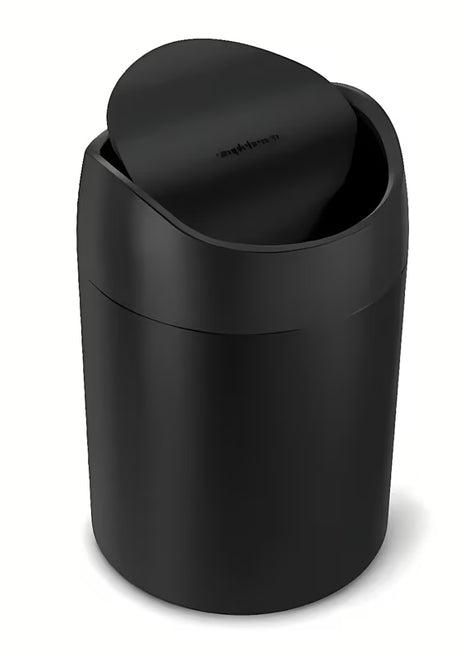 Crni stolni kanta za otpad Simplehuman Mini s preklopnim poklopcem i zapreminom 1,5 l.