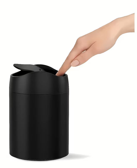 Crni stolni kanta za otpad Simplehuman Mini s preklopnim poklopcem i zapreminom 1,5 l.