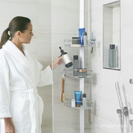Podesiva tuš šipka Simplehuman Shower caddy sa žičanim policama za kutnu ugradnju od nehrđajućeg čelika.