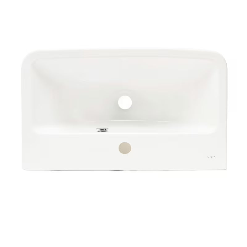 Bijeli viseći umivaonik Vitra Integra 60x36 cm od keramike s otvorom pro za slavinu u sredini i preljevom.