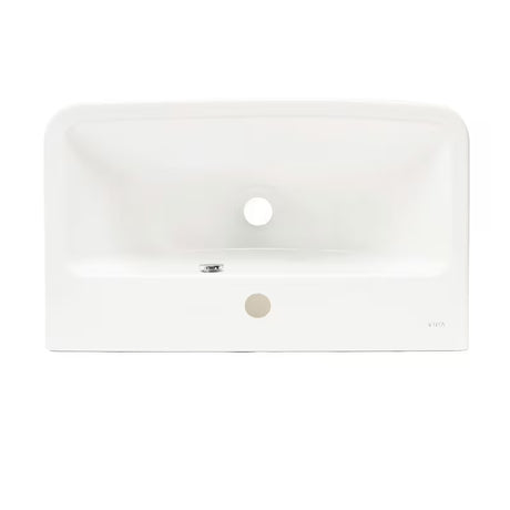 Bijeli viseći umivaonik Vitra Integra 60x36 cm od keramike s otvorom pro za slavinu u sredini i preljevom.